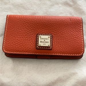 Pumpkin colored Dooney & Bourke wallet/clutch